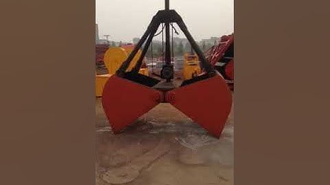 How does a clamshell crane grab work?