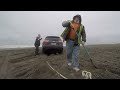 2  wheel drive jeep buried on beach 