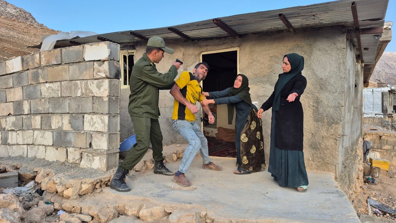 Afsaneh tries to arrest Agha Hussein with the help of a police officer.