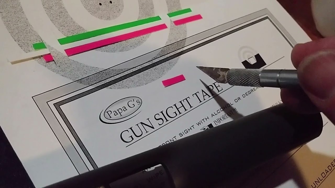 Putting gun sight tape on a 1911