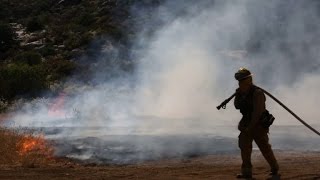 Wildfires rage in western US amid deadly heatwave
