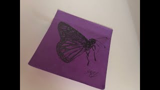Drawing A Butterfly On A Sticky Note