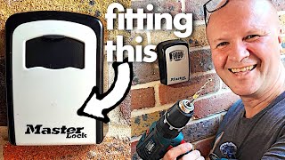 My Dads gonna get robbed!  (putting up a Master Lock combination key safe...)