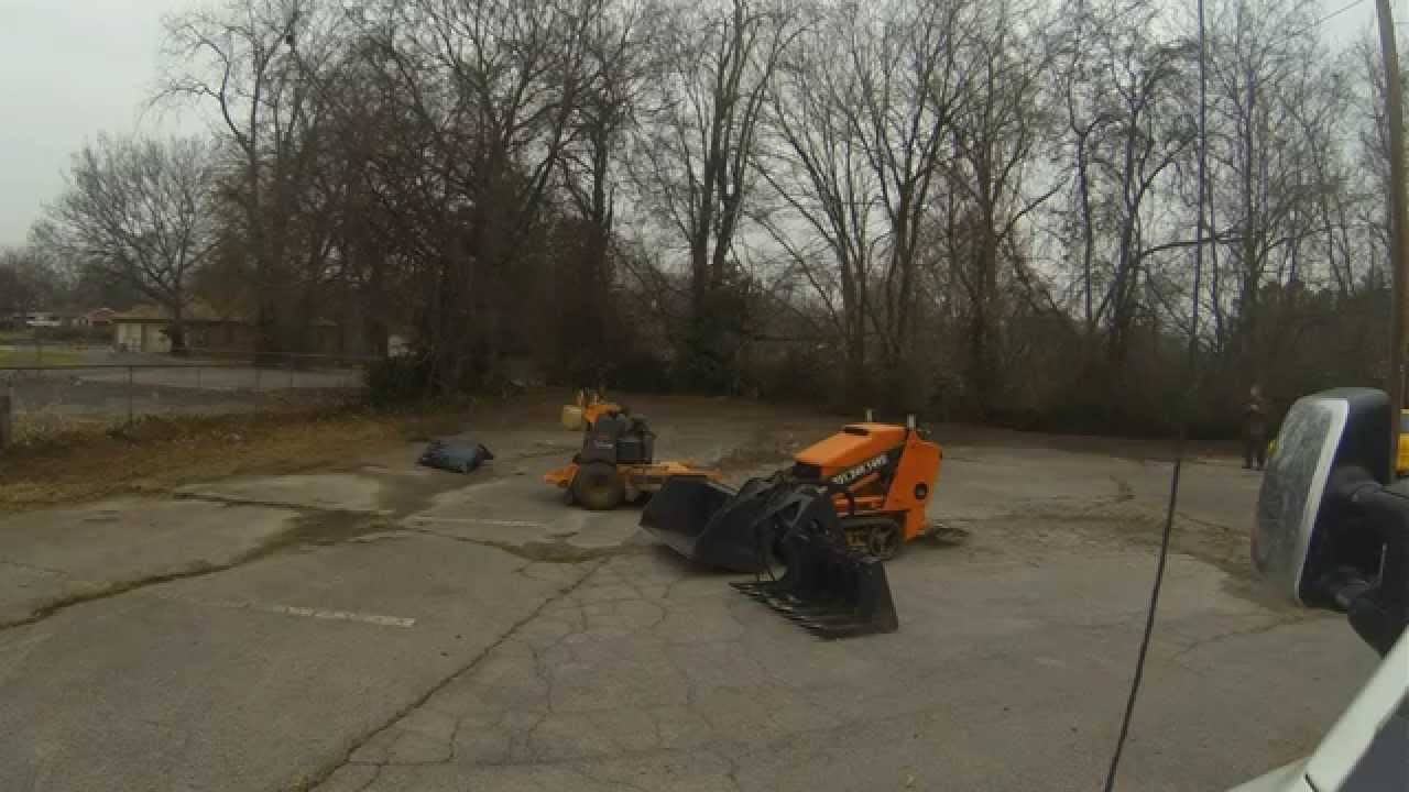 Brush, leaf and soil removal using a Dingo 525 Mini Skid steer