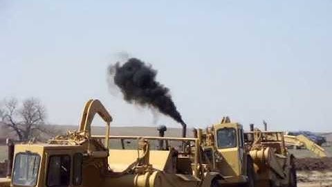 Twin engine 637E Scrapers in action push/pulling