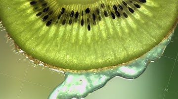 Super Slow Motion Macro Shot of Flowing Water from Kiwi Slice at 500fps.