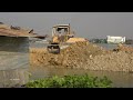 Wonderful Lake Filling Process Heavy Bulldozer Operator Pushing Dirt with 10 Wheels Truck Unloading