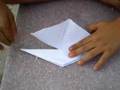 9yearold gloson folding an origami turtle