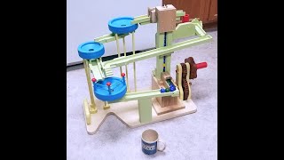 Neat Marble Pump Machine which divides marbles into two tracks and includes 3 bowls and 1 dumper.