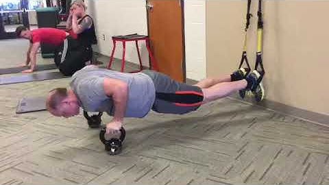 TRX Double Atomic Push Ups with Kettlebells