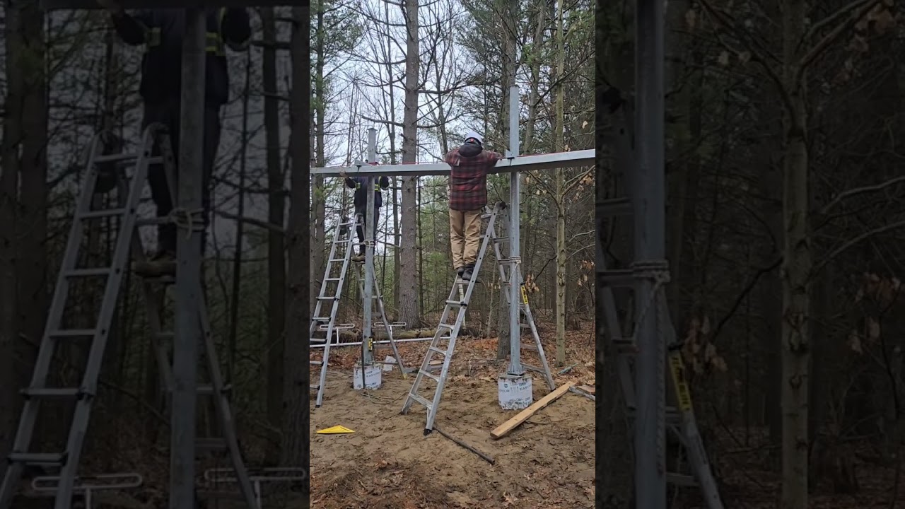 Riggers Installing a Cable Management Bridge. 