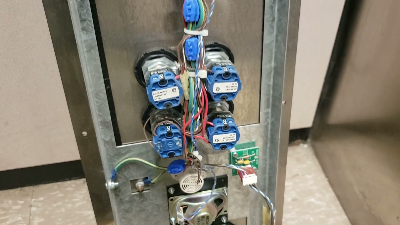 broken button in an otis 211 elevator control panel