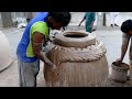 How skilled the poor workers are making large clay oven