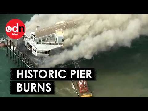 Видео: Moment Massive Fire Rips Through Iconic Oceanside Pier
