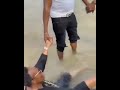 Former Governor of Ekiti state, Ayo Fayose, and his family members seen at a beach praying