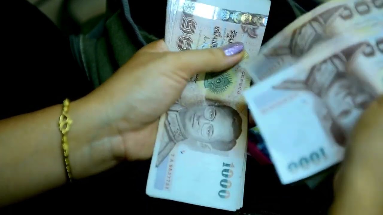VideoVault Stock Video: Thai baht notes are counted by hand