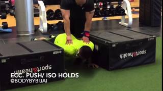 Eccentric push up with overcoming isometric