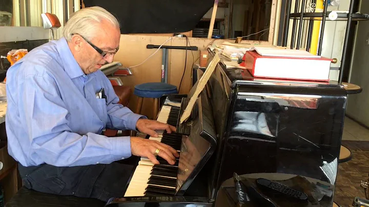 Piano-playing Barber John Hittner