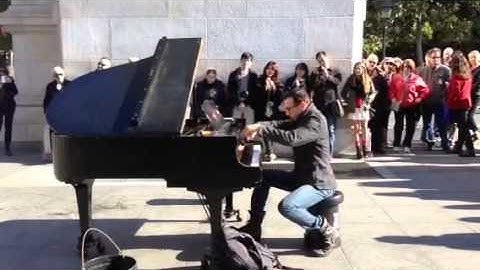 Colin Huggins playing piano in Washington Square Park