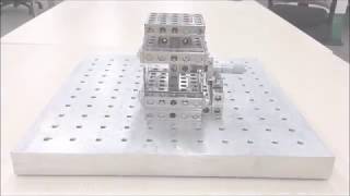 Compensating leaf-spring flexures for linear motion control – Folded Compound Linear Translator