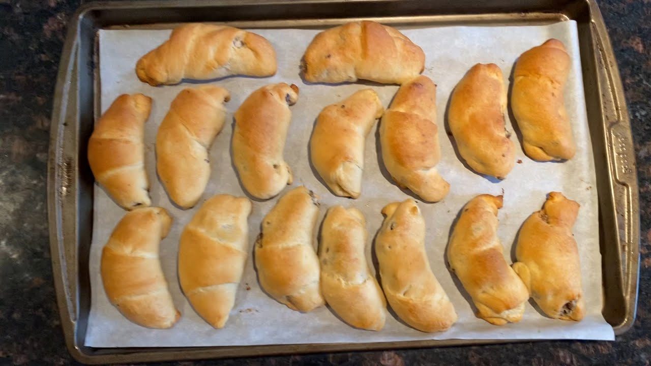 Prepping the cream cheese and sausage filling in Pillsbury Crescent dough  sheets - The Southerly Magnolia