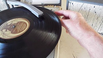 Columbia Compact STEREO 4 speed manual portable record player playing an LP