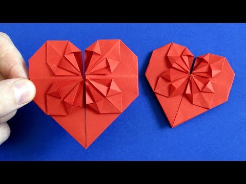Valentine paper with their hands. The heart of paper