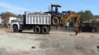 Loading a Backhoe into the truck.