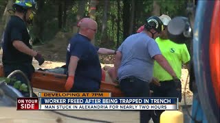 Worker free after being trapped in trench