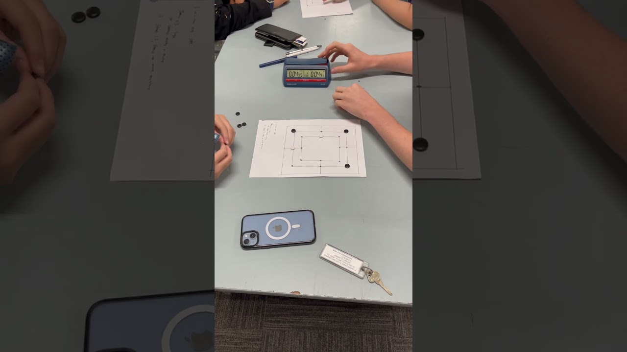 Nine men Morris tournament at camp