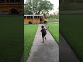 Little Boy Falls Onto Grass While Running to Catch School Bus