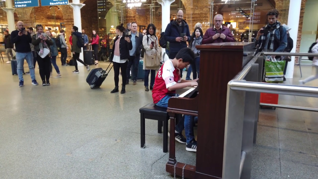 Young Football Fan Plays Bohemian Rhapsody Piano at Train Station Cole Lam 12 Years Old