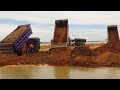 Best machinery filling land Bulldozer pushing soil and 10 wheel truck unloading soil