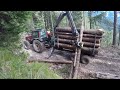 Loading logs on forestry trailer Palms 12D / Valtra 8350