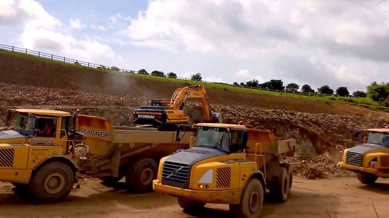 Hyundai HX 380 L excavator / trackk hoe at work loading rock trucks ...