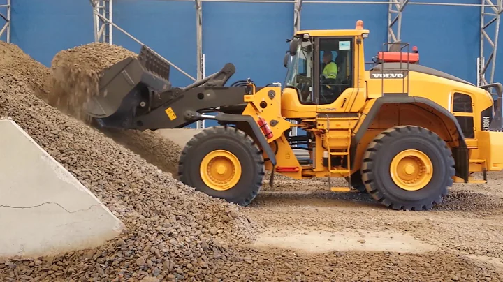 Wheel loader digging in pile of gravel