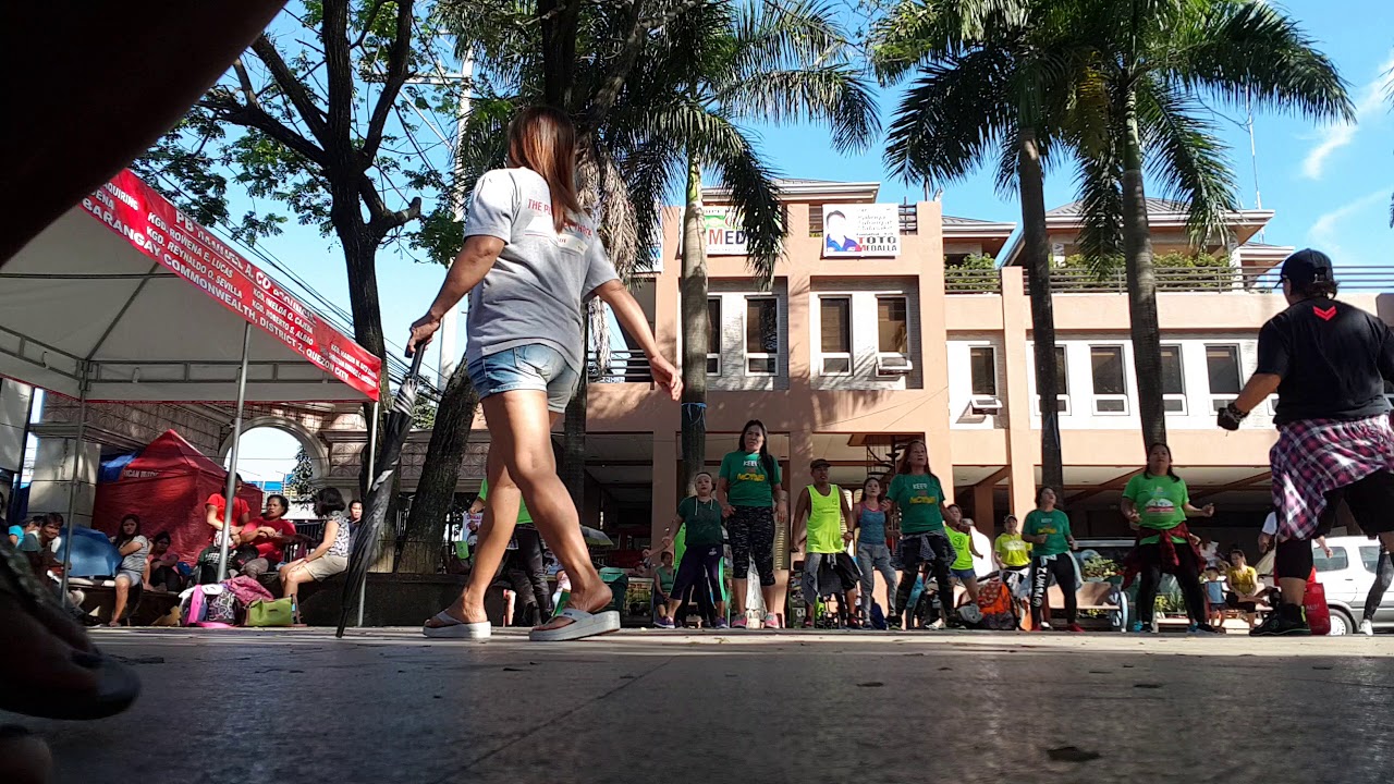 Zumbaranggay in green 7 dancing in the street