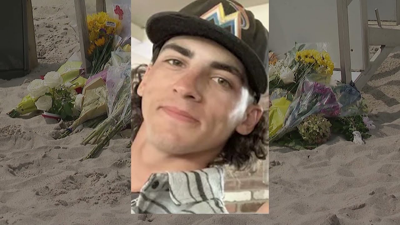 Hundreds gather for candlelight vigil honoring lifeguard killed by lightning