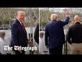 Trump waves at migrants across Rio Grande during visit to Texas border