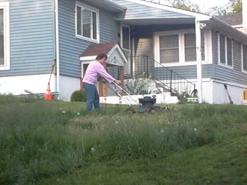 Judy trying to cut the grass