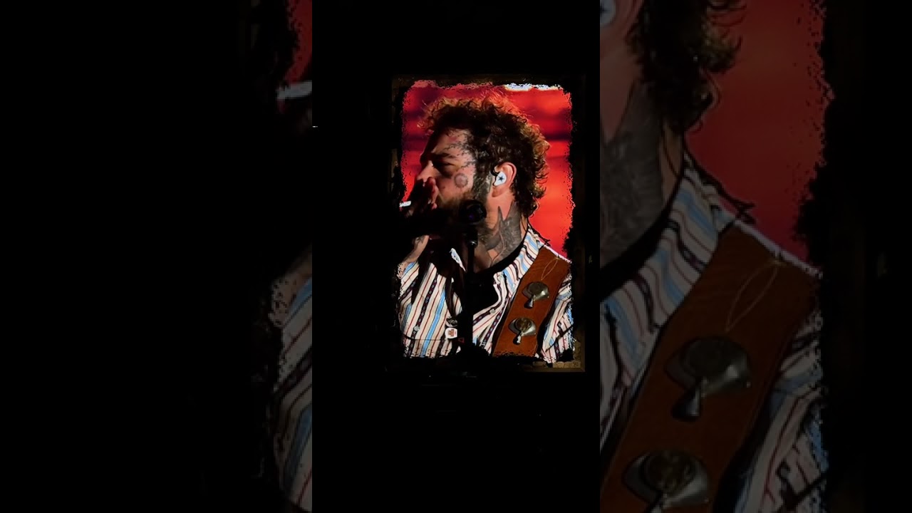 Post Malone playing his guitar 