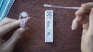 You have COVID symptoms, but your at-home test comes back negative. Should you test again