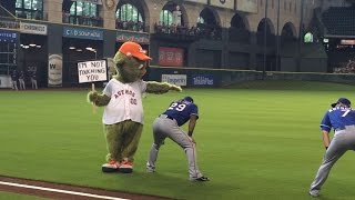 Astros mascot Orbit has fun with Rangers during warmups