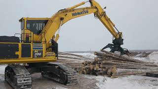 Unloading log truck with button top