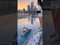 Graceful City Heroine Guiding a Tiny RC LNG Tanker Across Reflective Rooftop Water 🌇🚢