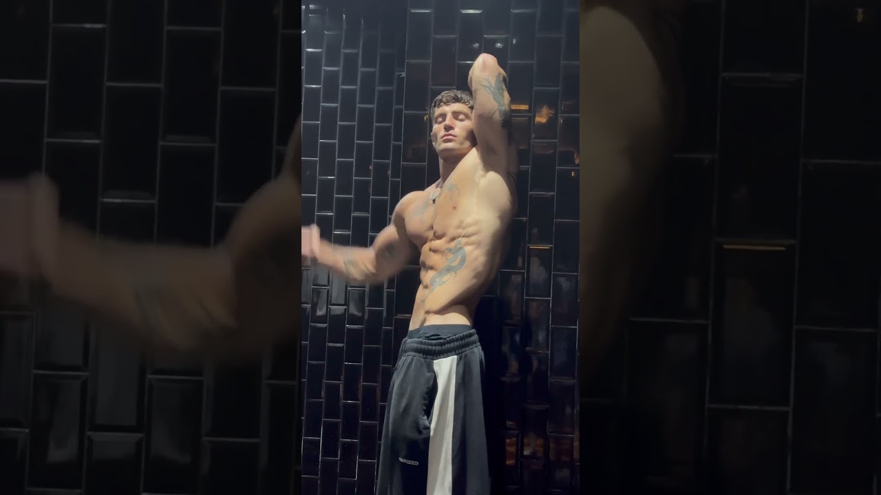 Tall tatted guy posing 