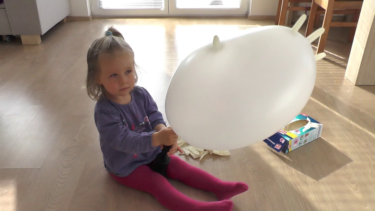 Having fun with huge balloons gloves