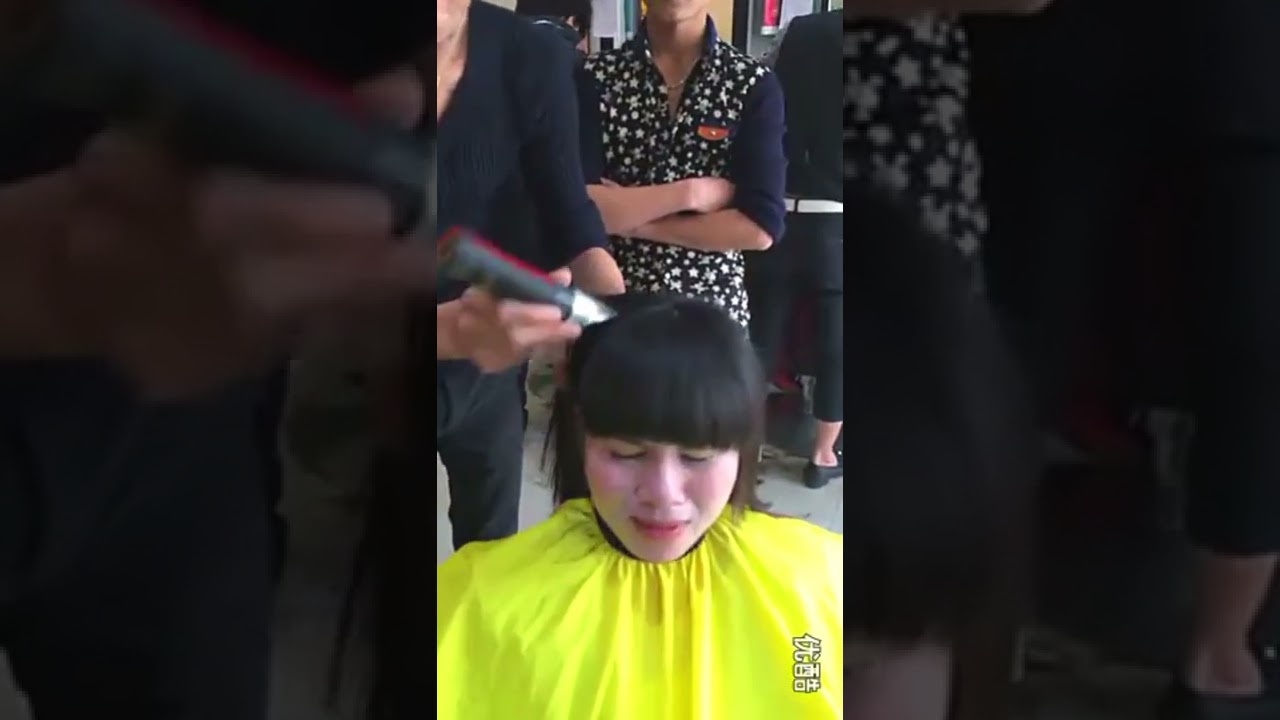 Women crying while head shave