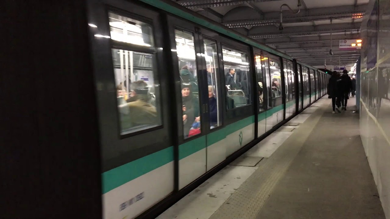 Metro line 4 departs from metro station Strasbourg Saint-Denis in Paris ...