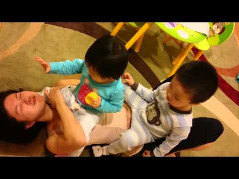 Babies jumping on mom